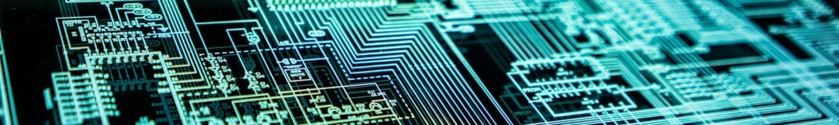 Glowing cyan digital circuit-board schematic displayed on a dark screen, with intricate lines, chips, and electronic pathways suggesting advanced technology or cybersecurity.